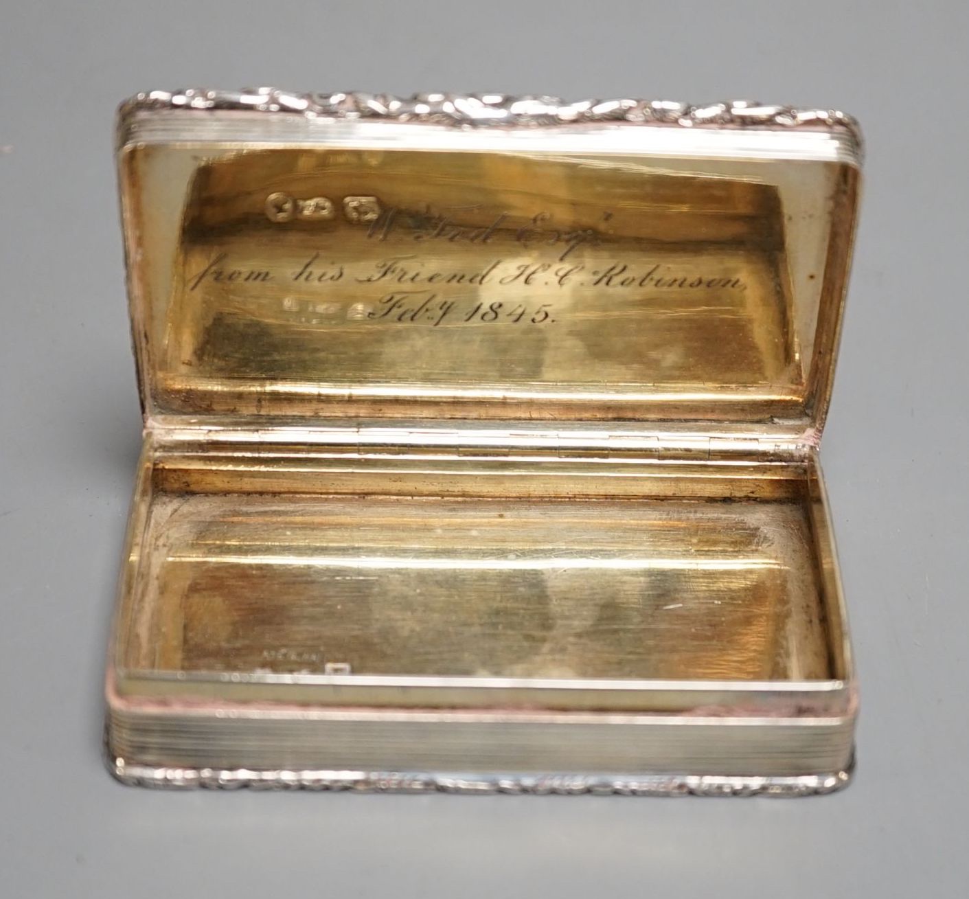 An early Victorian silver rectangular snuff box, with interior presentation inscription, Francis Clark, Birmingham, 1842, 82mm.